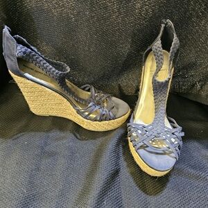 Suede “basket” weave high heeled shoe.